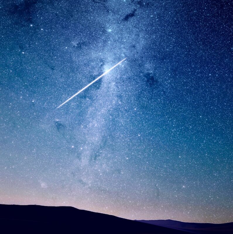 shooting star under blue sky